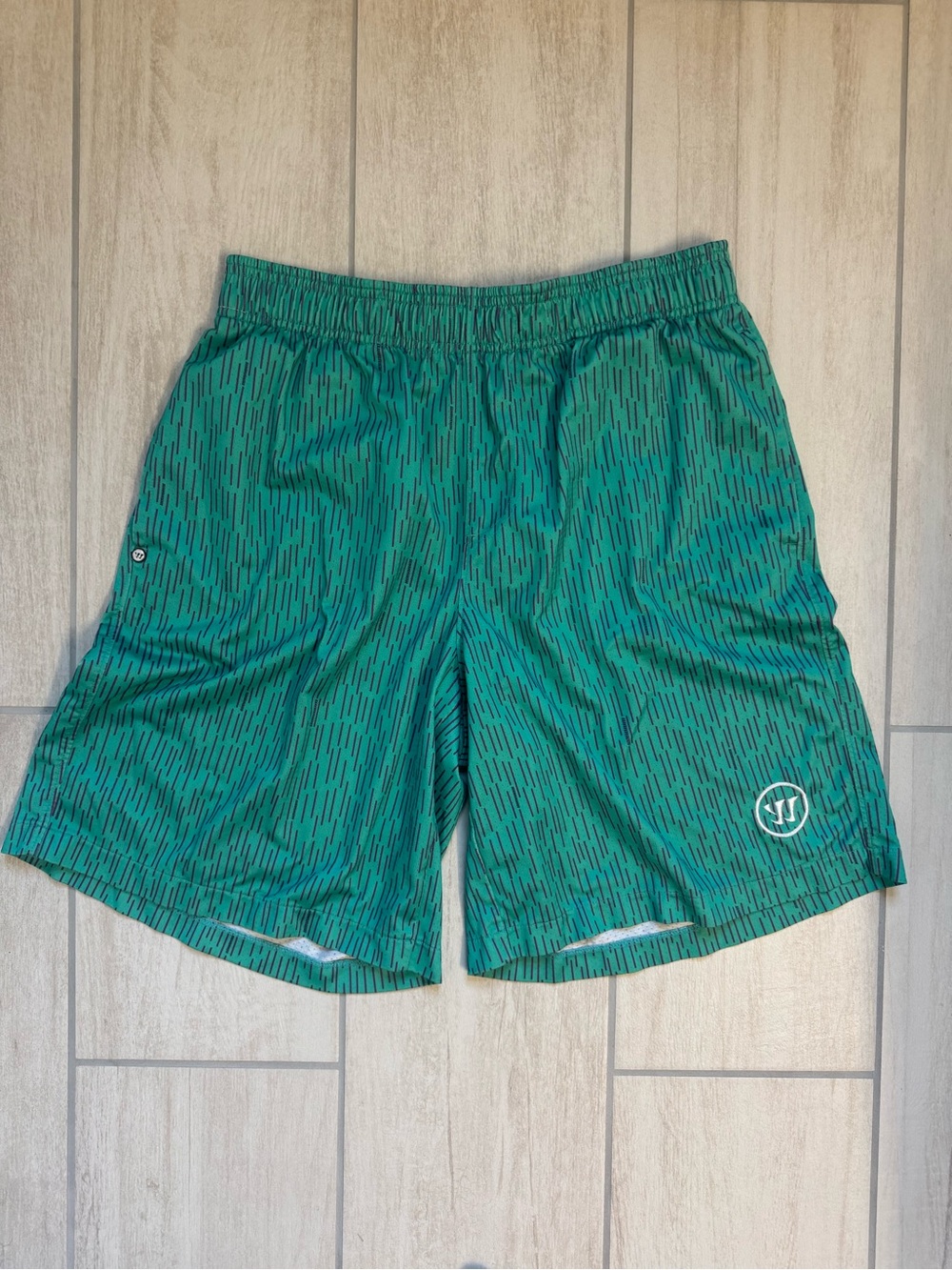 Green Athletic Shorts with Subtle Dash Pattern